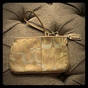 Gold coach wristlet